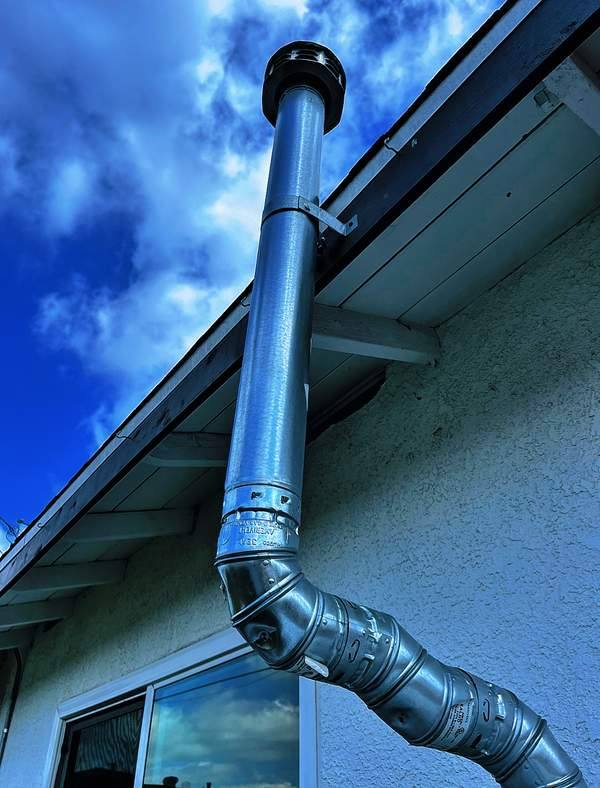 Flue installation for a residential HVAC system